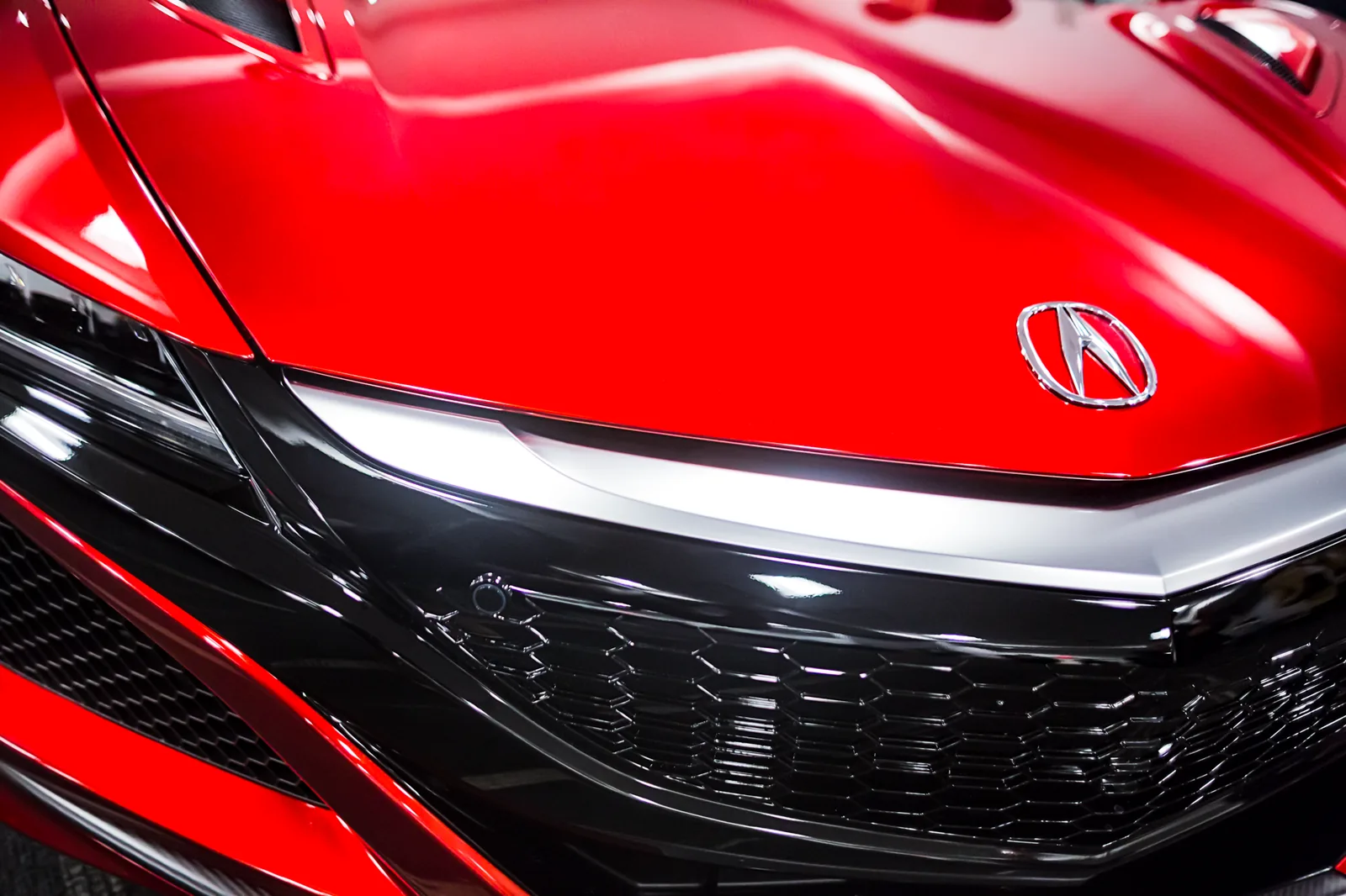 Close view of a red performance car photographed during manufacturing